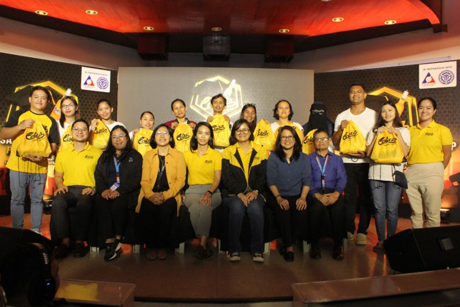 Beneficiaries pose with executives from Cobra, TESDA and DOLE.