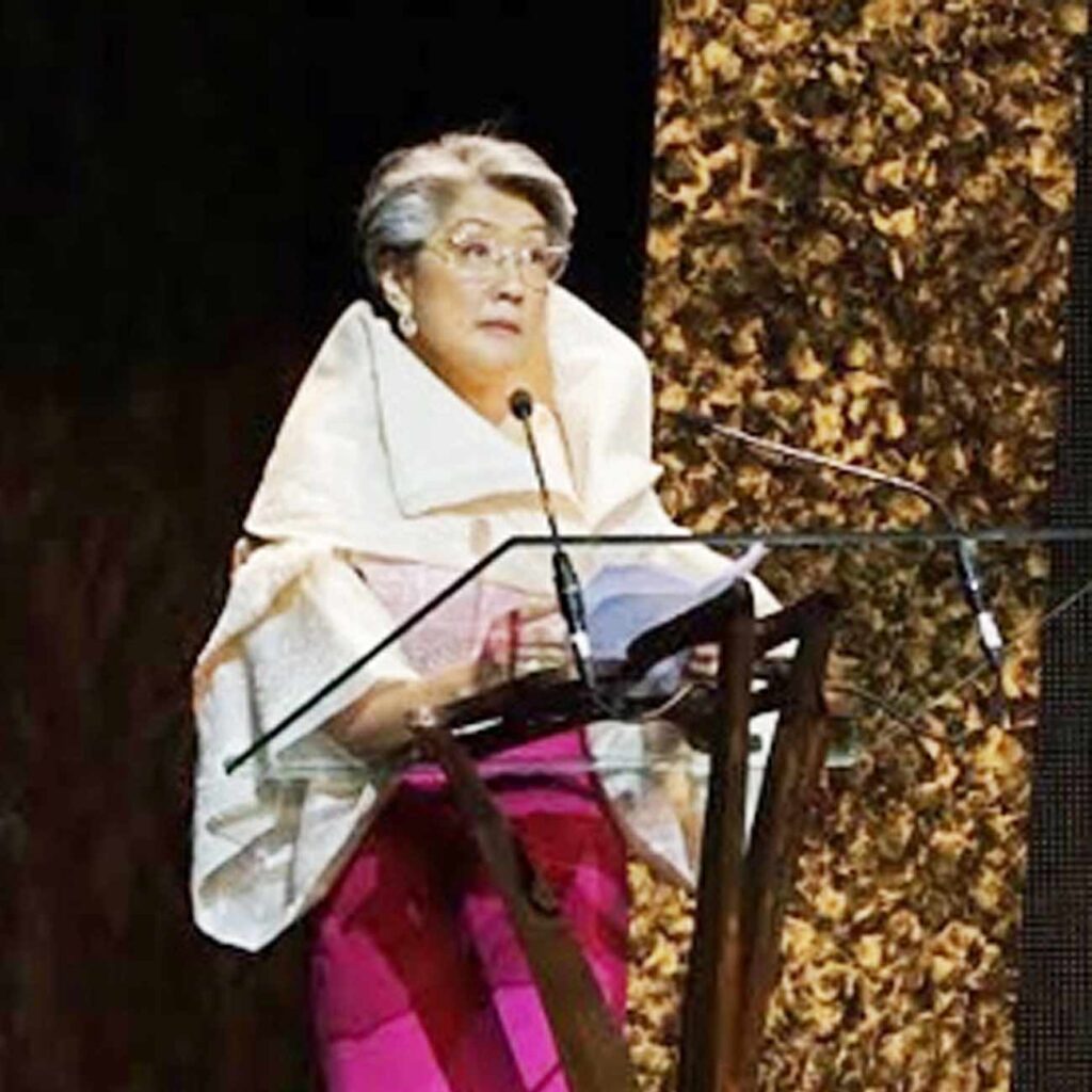 Irene Marcos-Araneta reads a speech on behalf of her brother President Ferdinand Marcos Jr.