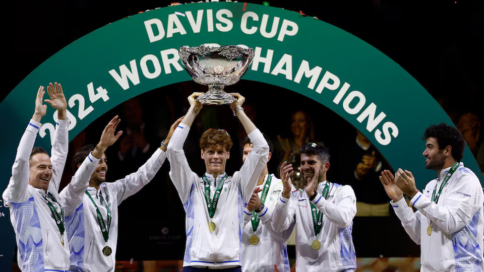 BEST OF ‘EM: Jannik Sinner proudly raises the Davis Cup trophy. Reuters Photo