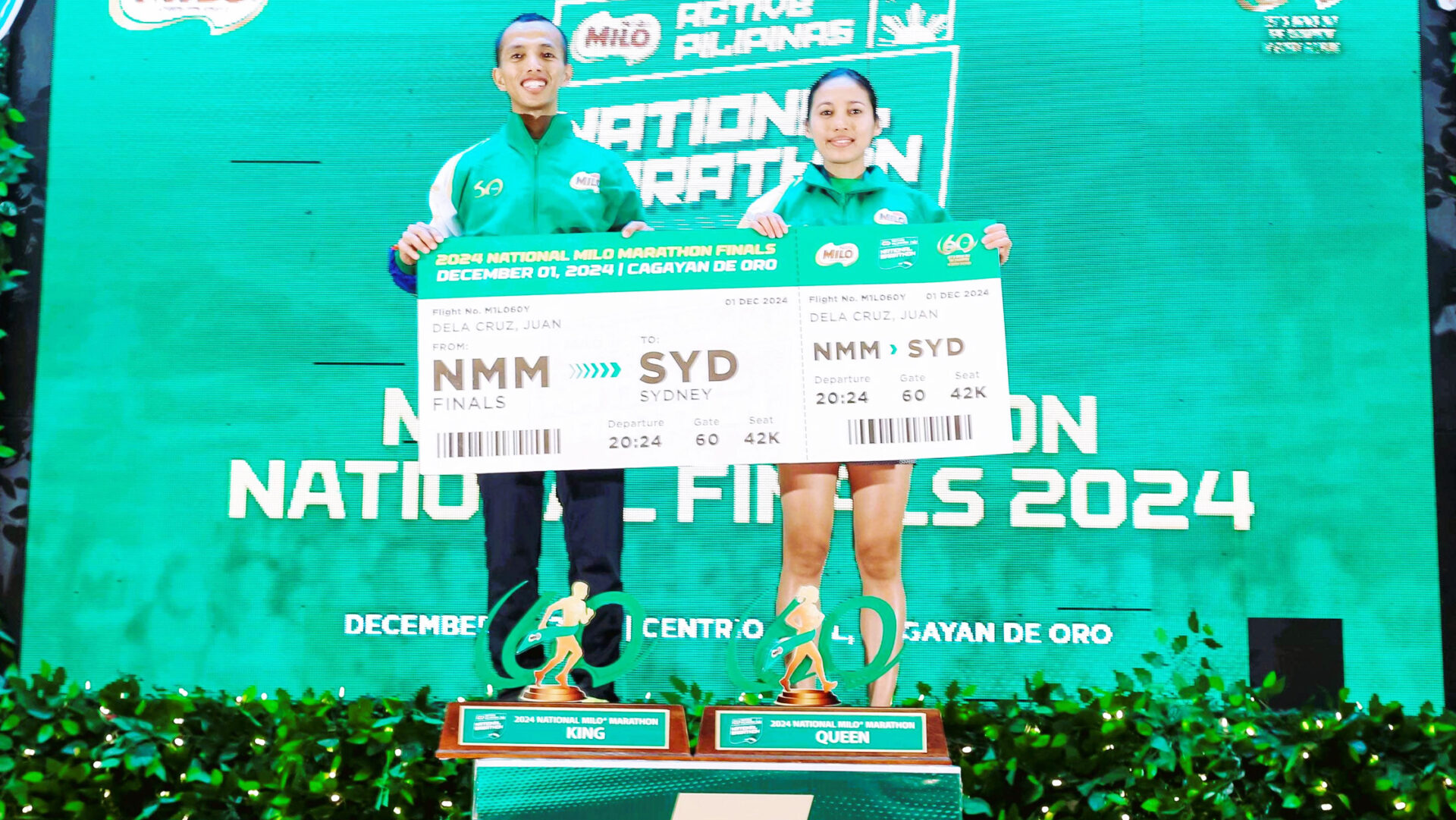 SHOWING ‘EM: Richard Salaño (left) and Chrisine Hallasgo are bound for the Sydney International Marathon after ruling the men’s and women’s division of the national Milo Marathon finals in Cagayan de Oro City over the weekend.