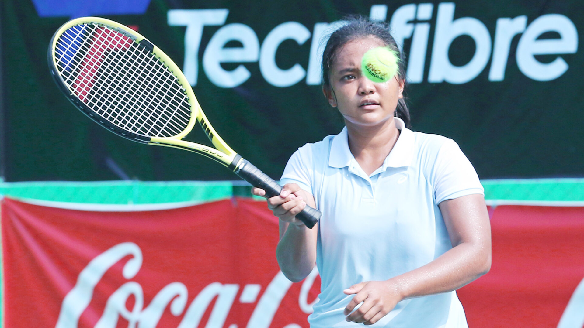 HARD TO STOP: Tenielle Madis makes a forehand return to Indonesian Joanne Lyn Hartono during their second-round match.