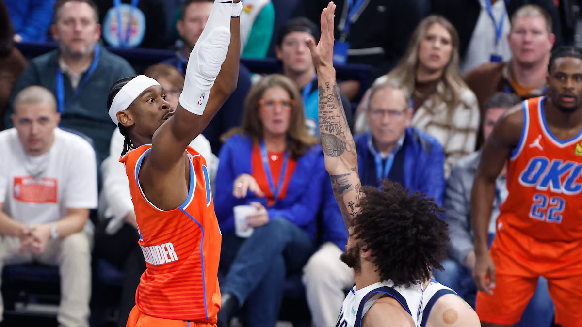 TAKING CHARGE: Thunder star Shai Gilgeous-Alexander (2) shoots off Mavs counterpart Luka Doncic (77) and center Dereck Lively II (2) in yesterday’s game.