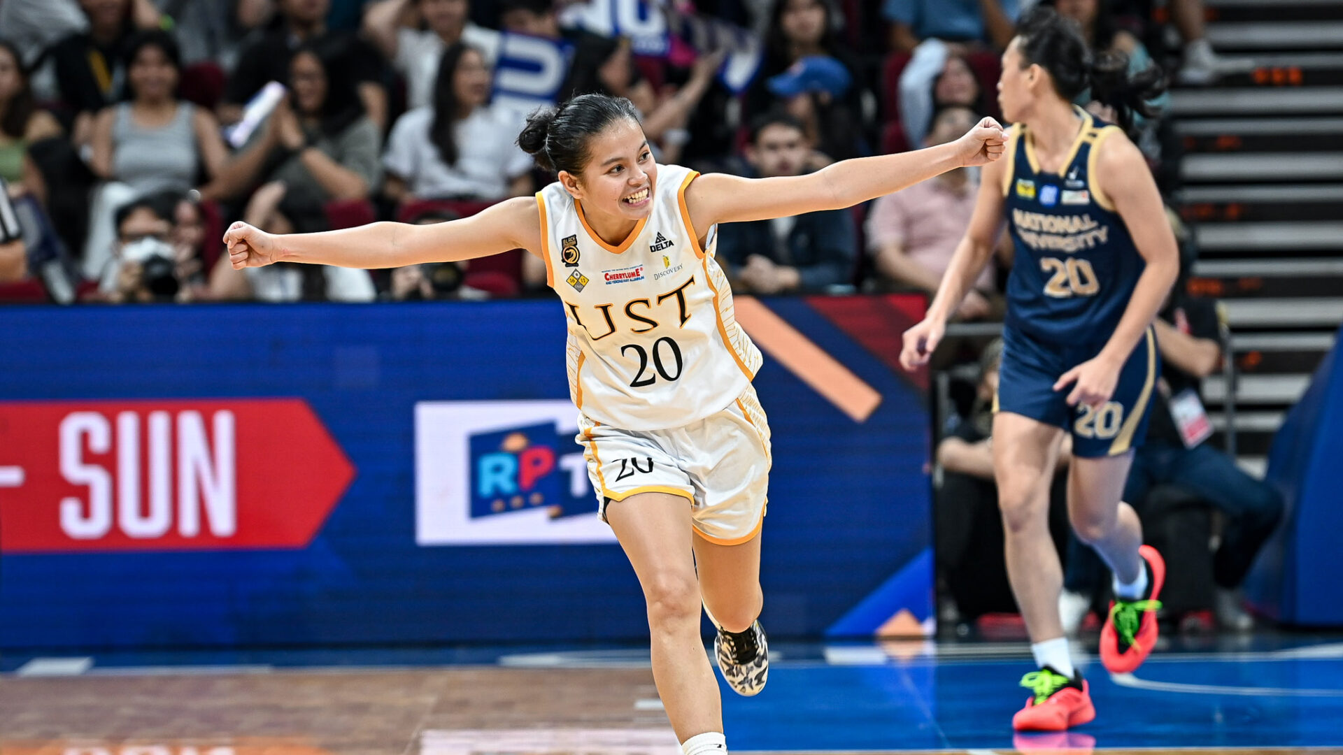 WELL DONE: UST gunner Karylle Sierba celebrates after hitting a big basket in yesterday’s game.