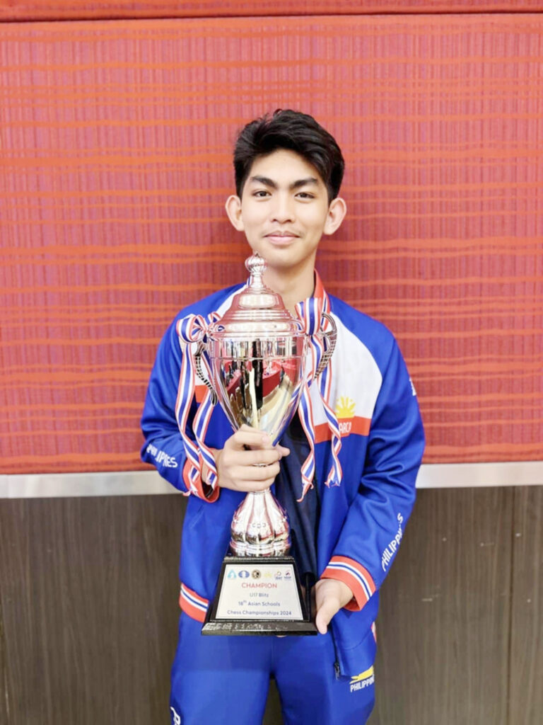 BEST OF ‘EM: Christian Gian Karlo Arca shows the latest addition to his trophy case.