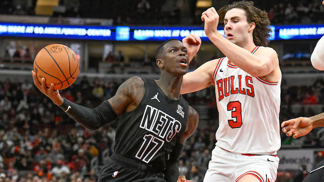 IN VAIN: Nets guard Dennis Schroder (17) drives to the basket off Bulls counterpart Josh Giddey in yesterday’s game.
