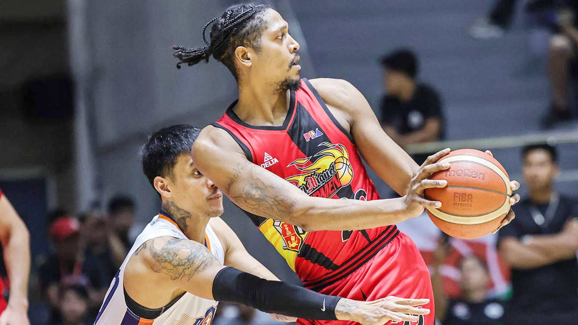 EYEING PAYBACK: San Miguel Beer import Malik Pope, here guarded by Meralco big man Raymond Almazan, is expected to do more for the Beermen today. PBA PHOTO
