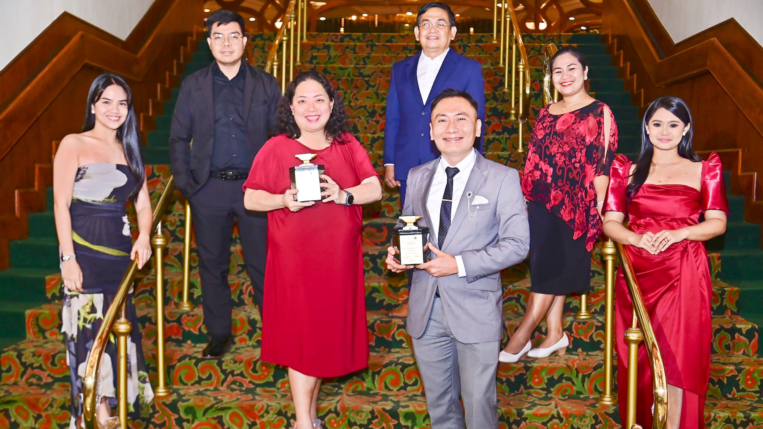 (Center from left) SMFI Education Programs SAVP Eleanor Lansang, Corporate Affairs and Sustainability SAVP Victor Chan and team members of the SM Foundation receive two Silver Awards at The Manila Hotel on Jan. 28, 2025.