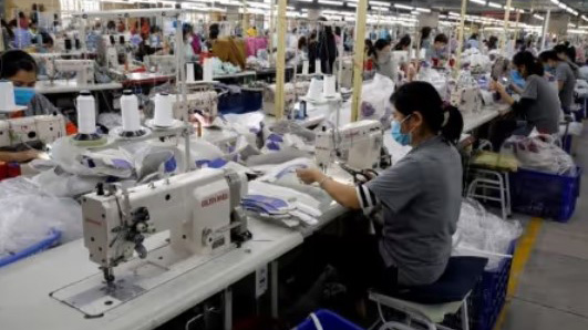 Employees work at a shoe factory for export in Hanoi, Vietnam. (Reuters Photo)