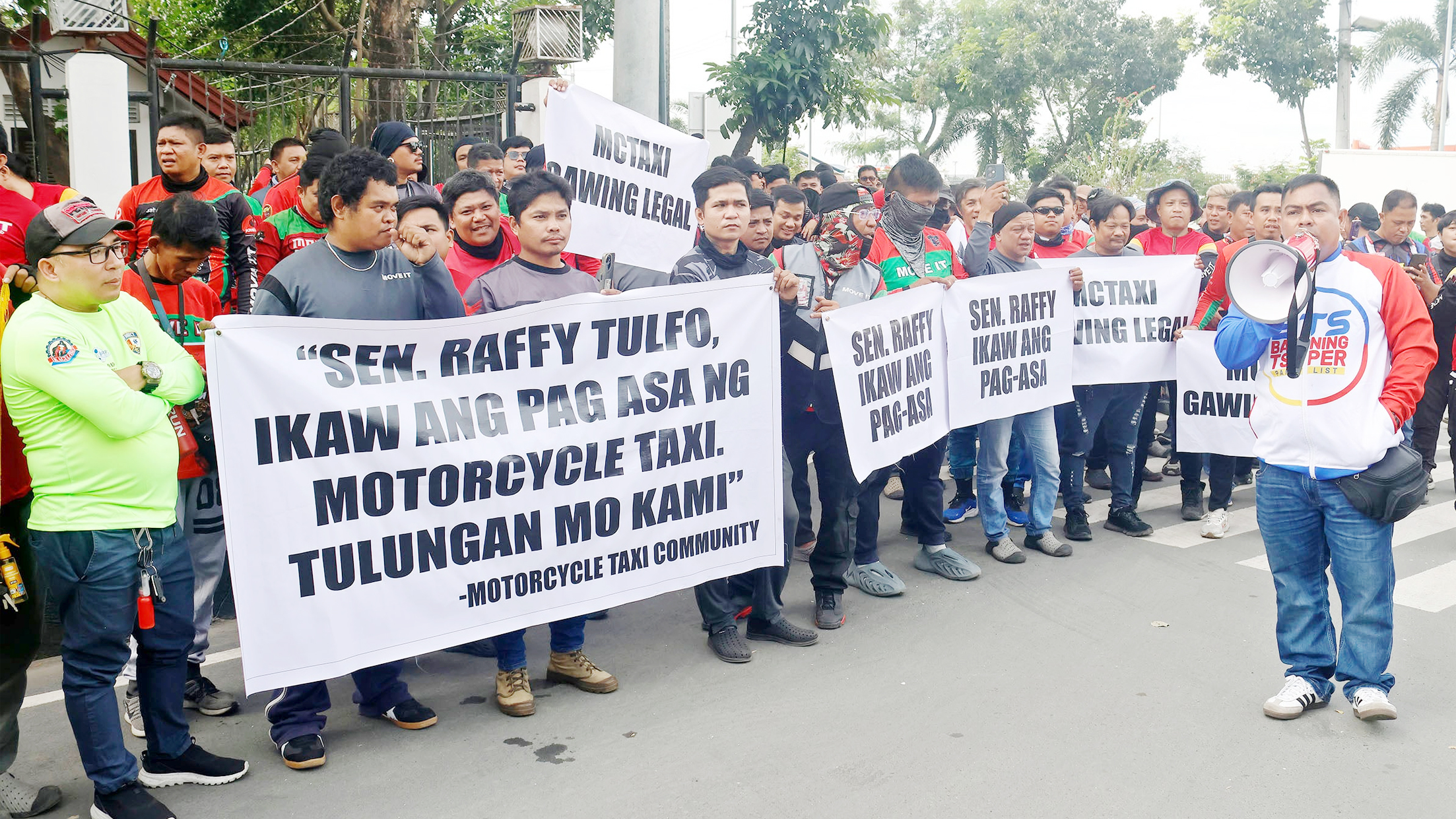 Seeking legalization. Riders belonging to the group Motorcycle Taxi Community Philippines stage a protest rally in front of the Senate on Tuesday seeking the legalization of motorcycle taxis. PHOTO BY RHOY COBILLA