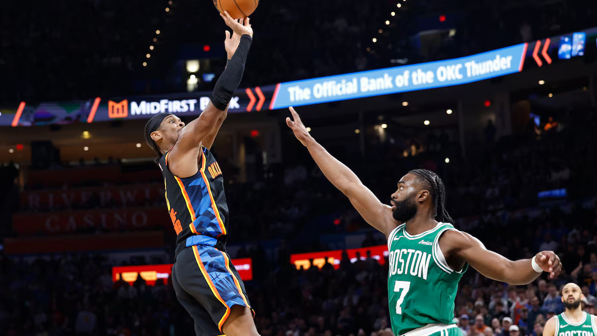 TAKING CHARGE: Thunder star Shai Gilgeous-Alexander (2) pulls up off Celtics counterpart Jaylen Brown (7) in yesterday’s game.