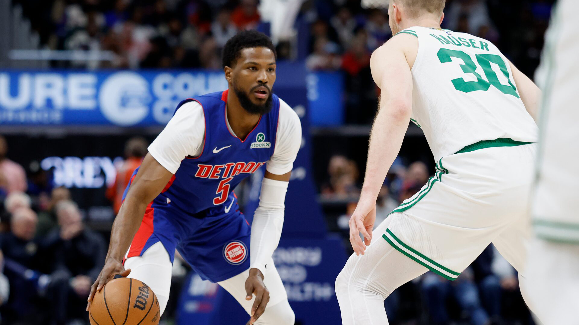 WILY: Pistons guard Malik Beasley (5) dribbles off Celtics forward Sam Hauser (30) in second action in yesterday’s game. (Reuters Photo)