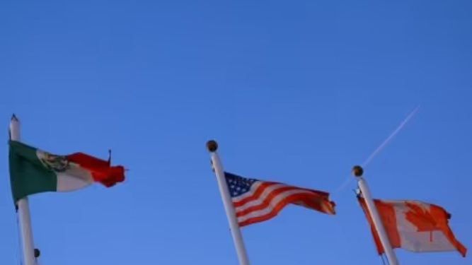 The flags of Mexico, the United States and Canada fly in Ciudad Juarez, Mexico. (Reuters Photo)