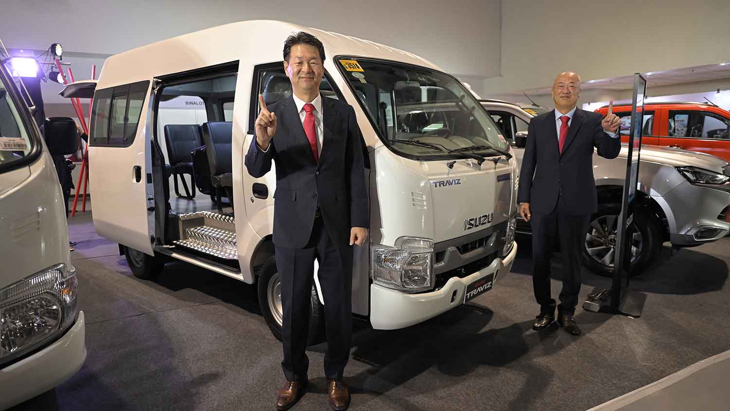 Tetsuya Fujita and Shojiro Sakoda, president and executive vice president, respectively, at Isuzu Philippines Corp. pose with the Traviz Concept Van at the 2025 Isuzu Truck Fest at the SMX Convention Center on Feb. 28, 2025.