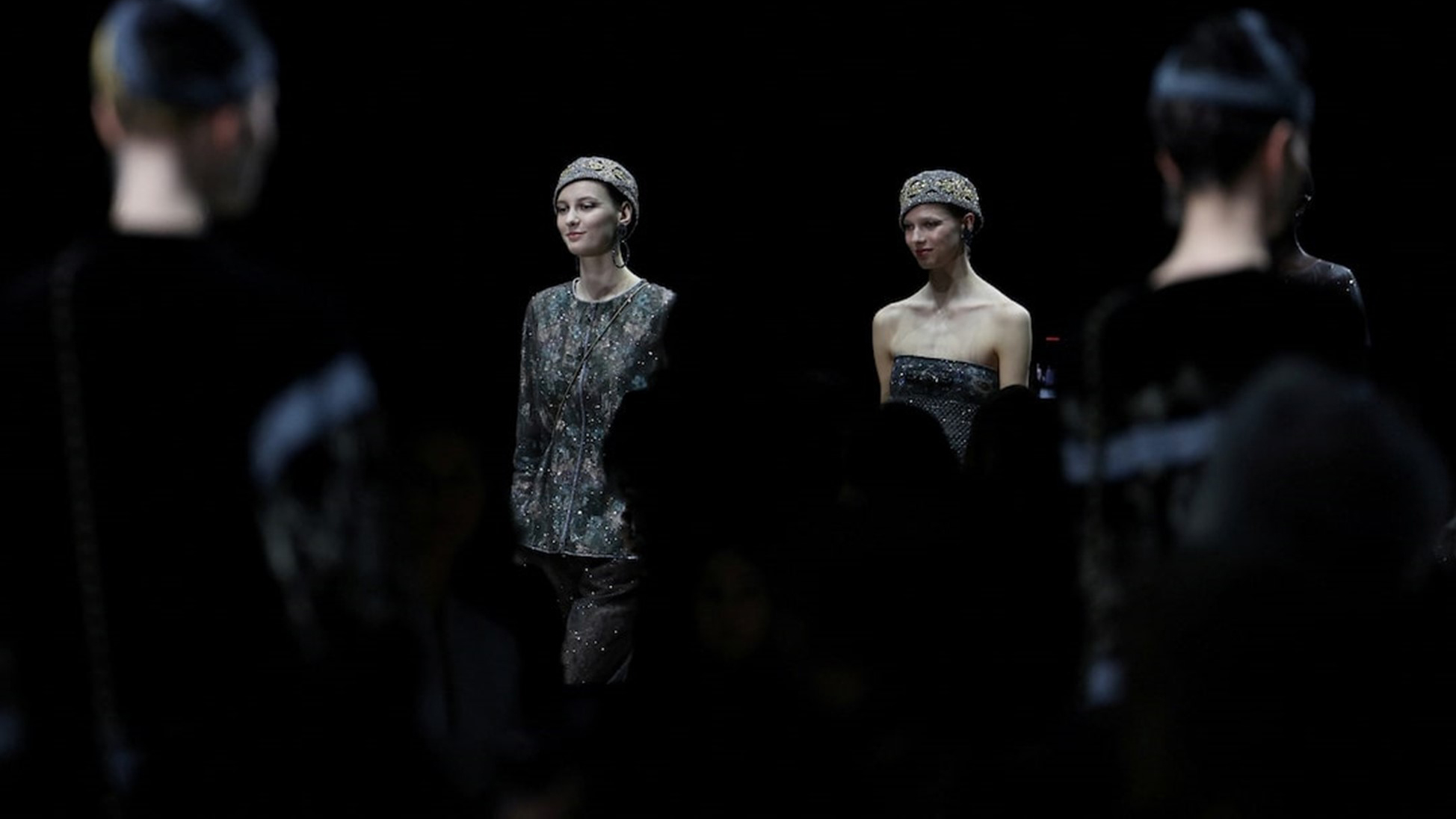 Models present creations from the Giorgio Armani Fall/Winter 2025/2026 collection during Fashion Week in Milan, Italy.