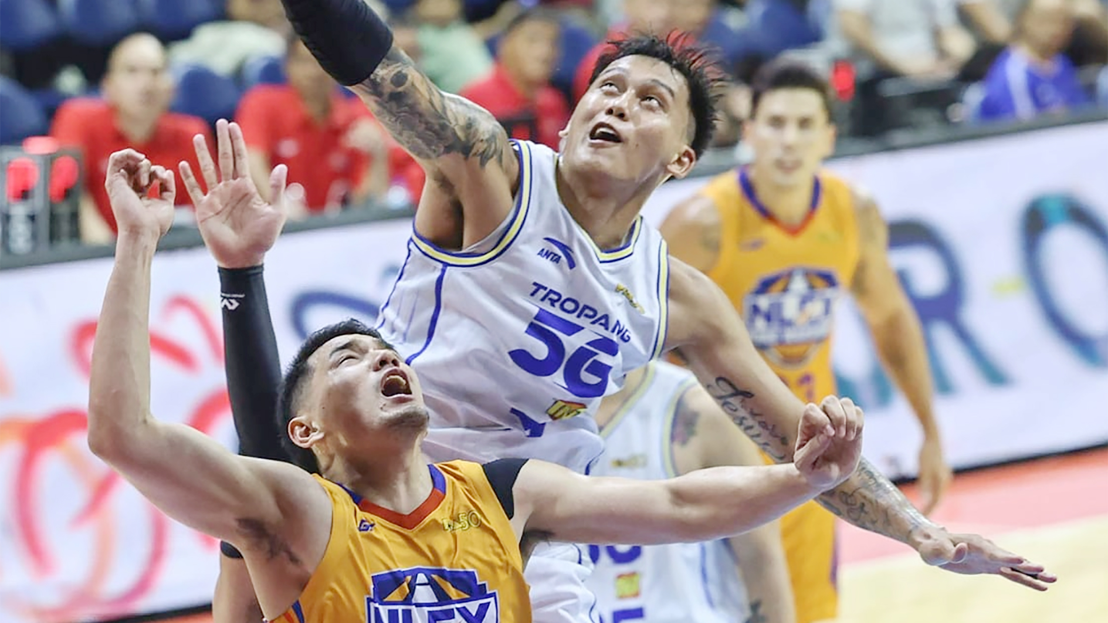 STYMIED: TNT center JP Erram blocks a shot by NLEX guard Kevin Alas in last night’s game.